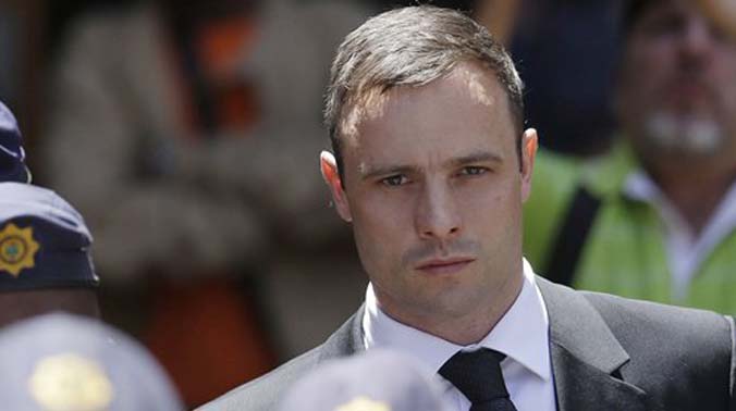 Oscar Pistorius is escorted by police officers as he leaves the high court in Pretoria, South Africa (Photo: AP) Oscar Pistorius is escorted by police officers as he leaves the high court in Pretoria, South Africa (Photo: AP)